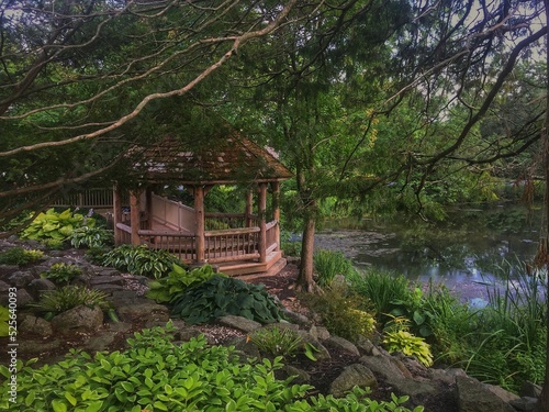Fotografija Beautiful shot of a wooden alcove by a lake