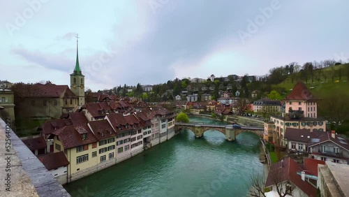 The rainy day in Bern with a view on Untertor Bridge, River Aare, Altstadt, Nydeggkirche and Felsenburg tower, Switzerland photo