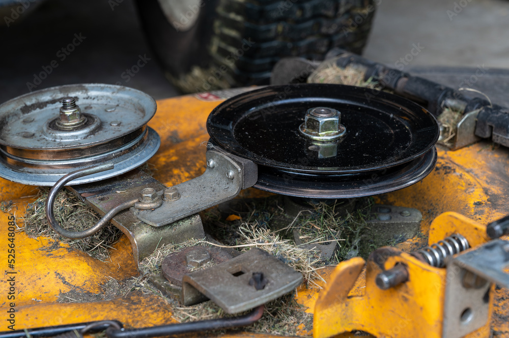 Lawn mower deck and brake mechanism for drive belt. Stock Photo Adobe