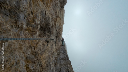 Fotografie, Obraz climbing the via ferrata via delle bocchette mountain sign in the brenta Dolom