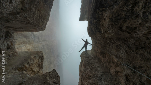 Canvas Print woman climbing the via ferrata via delle bocchette mountain sign in the brenta