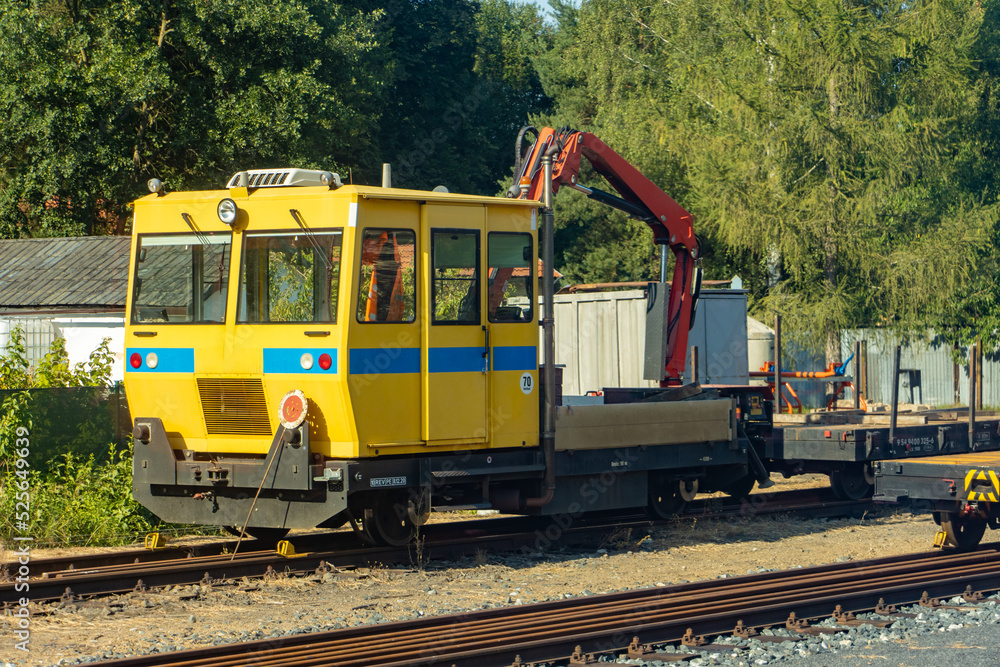 The service rail vehicle with crane on a railways station The service rail vehicle with crane on a railways station