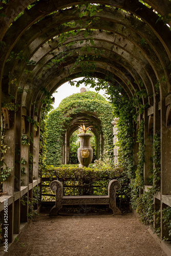 arch in the park garden of arundel castle england countryside vase 