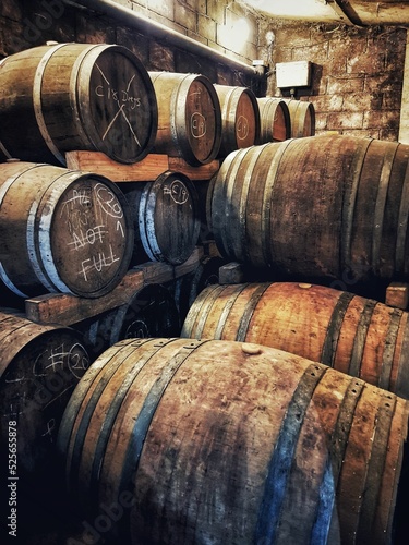 Murais de parede Vertical shot of wine barrels in a wine estate in South Africa