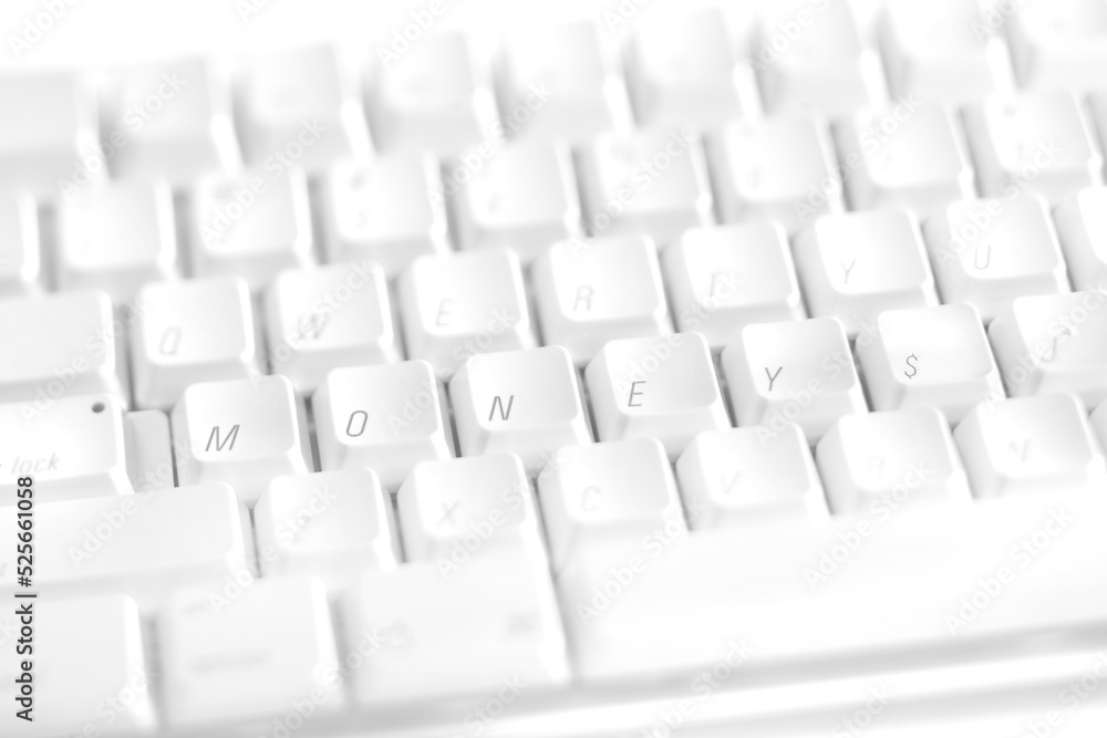 White computer keyboard keys reorganized to spell outthe word MONEY White computer keyboard keys reorganized to spell outthe word MONEY