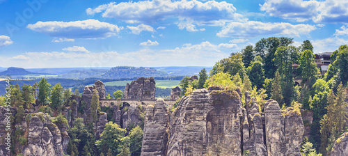 Beautiful landscape, panorama, banner - view of the Bastei rock formations and the Bastei Bridge in the Elbe Sandstone Mountains, in Saxony, Germany photo