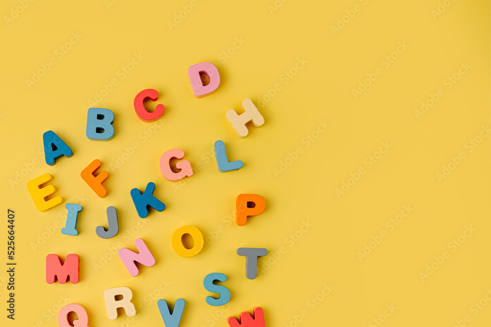 Colorful letters of the alphabet on yellow background. Primary school