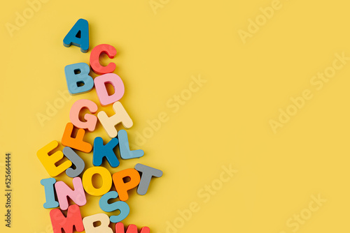 Tableau sur toile Colorful letters of the alphabet on yellow background