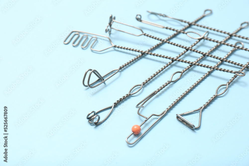 Set of logopedic probes for speech therapy on light blue background Set of logopedic probes for speech therapy on light blue background