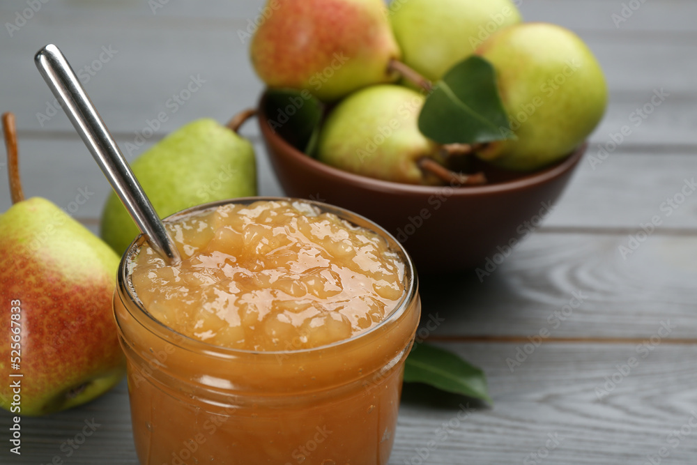 Delicious pear jam and fresh fruits on grey table, closeup Delicious pear jam and fresh fruits on grey table, closeup