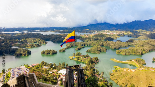 Bandera de Colombia ondeando sobre el lago de Guatapé photo