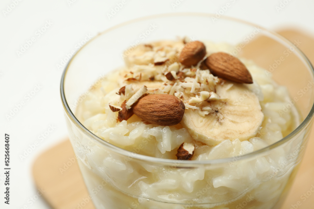 Delicious rice pudding with banana and almonds, closeup Delicious rice pudding with banana and almonds, closeup