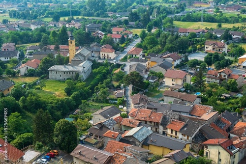 Aerial view of the village of Foresto with red-roofed houses and green trees photo