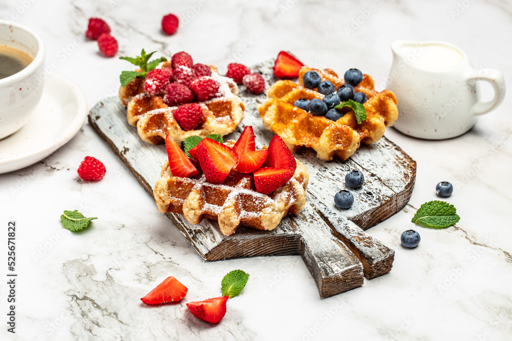 belgian waffles. Berry Belgian Waffle with raspberries, strawberries and blueberries. Delicious breakfast or snack