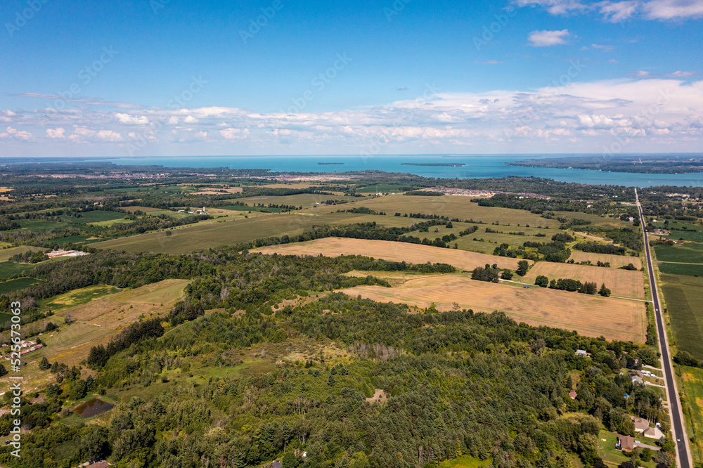 Obraz premium Innisfil water front beach shore line with farm land and lake simco in view 