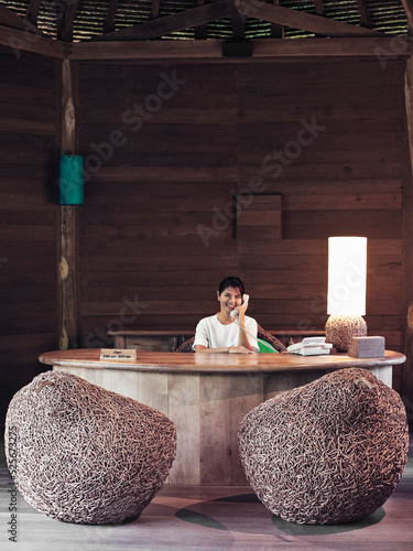 A spa receptionist organizes appointments for guests. Yao Noi. Thailand.