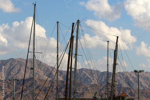 Ship masts against the blue sky.