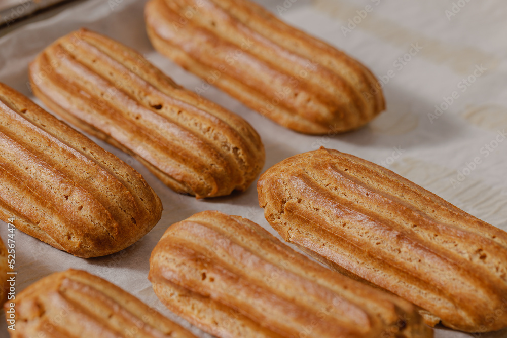 fresh baked eclairs, concept for bakery or patisserie fresh baked eclairs, concept for bakery or patisserie