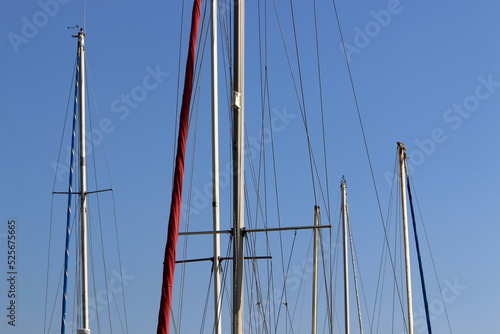 Ship masts against the blue sky.
