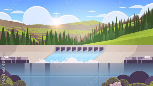 Hydroelectric power production station water spills over the top of dam hydro energy industrial renewable energy sources