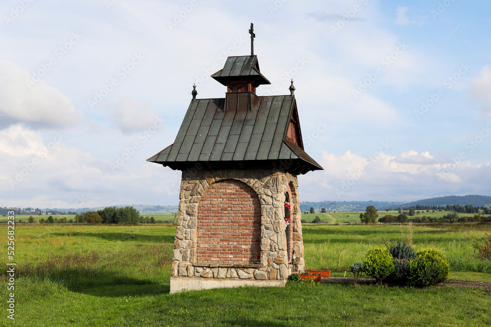 CZARNY DUNAJEC, POLAND - AUGUST 23, 2022: A roadside shrine nearby the Czarny Dunajec city. CZARNY DUNAJEC, POLAND - AUGUST 23, 2022: A roadside shrine nearby the Czarny Dunajec city.