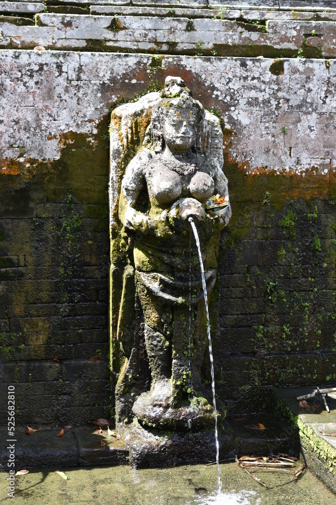 Single Female Fountain Statue Pouring Water into Reflecting Pool at Goa Gajah Hindu Temple, Bali