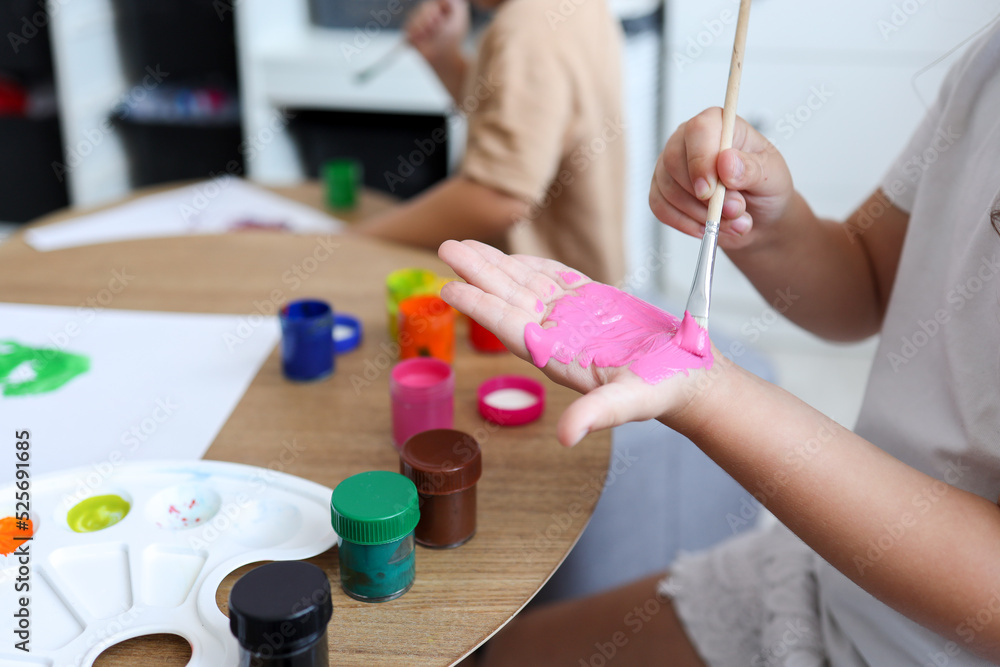 Children's drawing happy children make handprints with paint