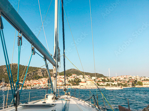 Boat sailing into the harbor - Hvar, Croatia