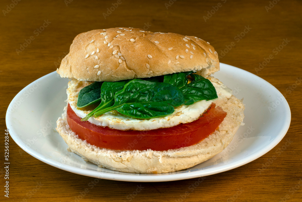 breakfast sandwich of spinach, tomatoand egg breakfast sandwich of spinach, tomatoand egg