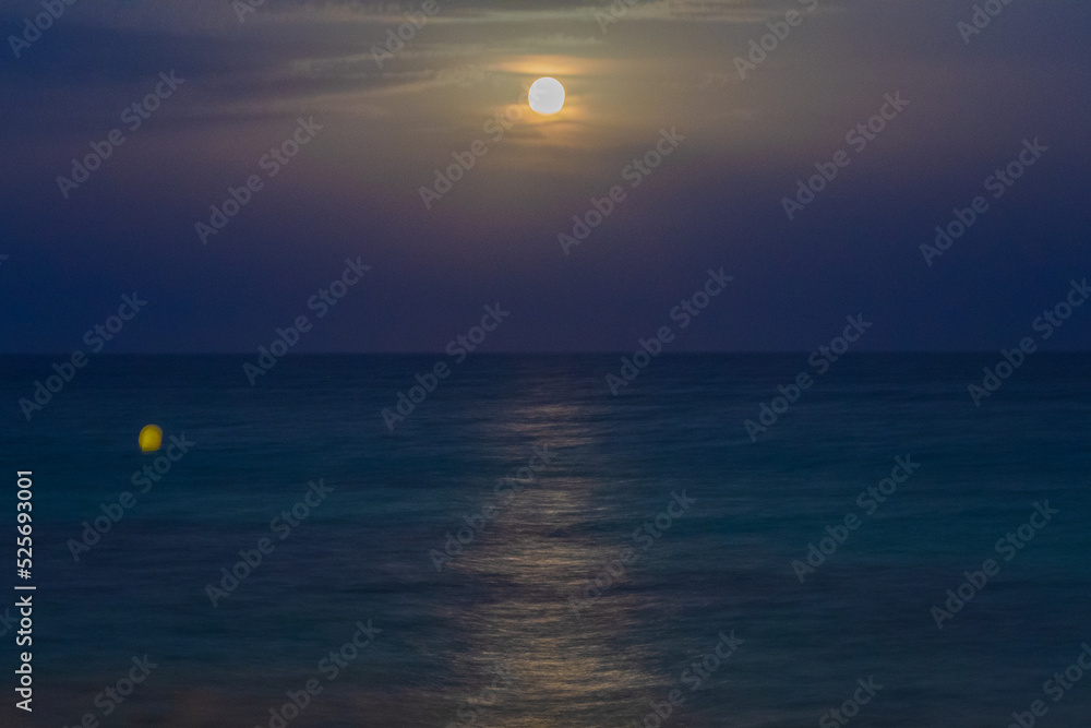 Cityscape of the Moon risinng from the mediterranean sea (Torrevieja,Alicante,  Spain)