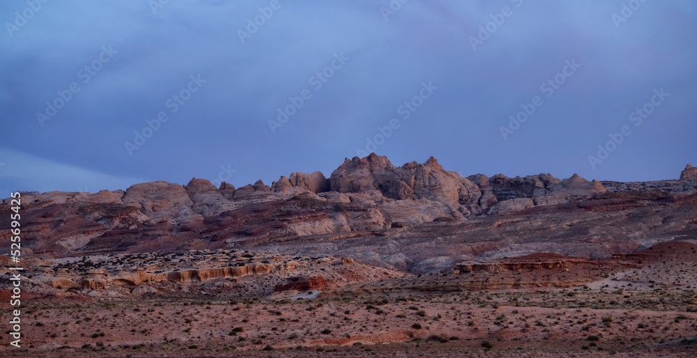 Red Rock Formations in Desert at Sunset. Spring Season. Goblin Valley State Park. Utah, United States. Nature Background. Red Rock Formations in Desert at Sunset. Spring Season. Goblin Valley State Park. Utah, United States. Nature Background.