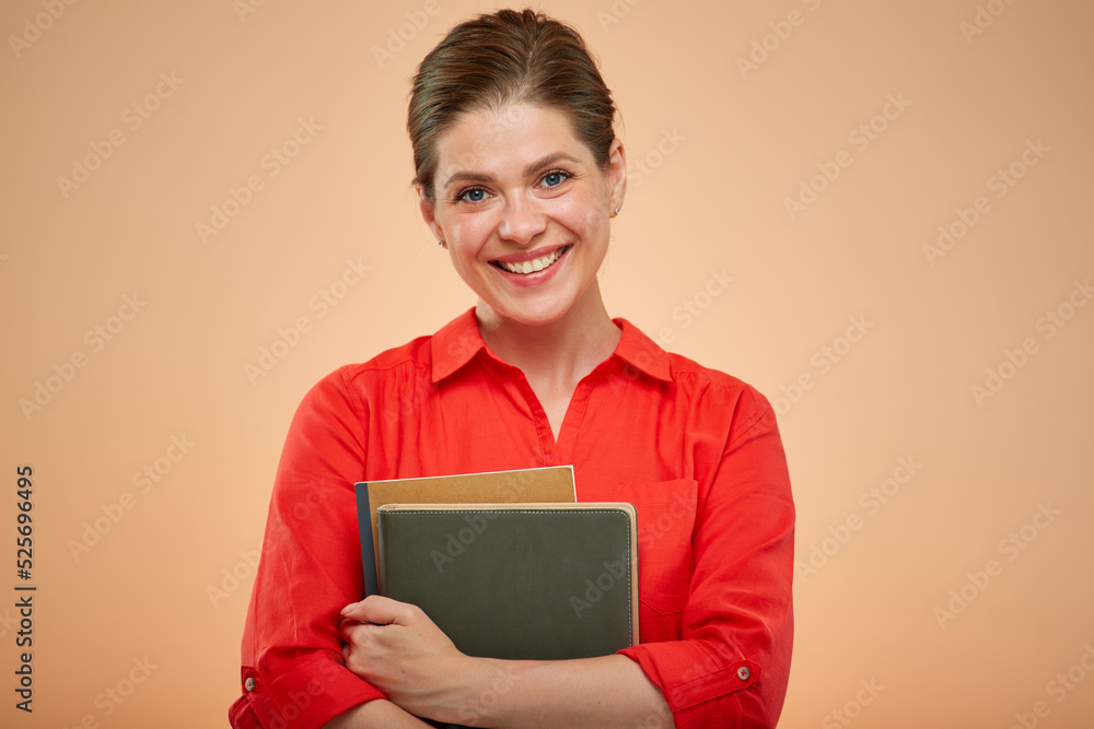 Isolated portrait of smiling teacher. Adult female student with book. Isolated portrait of smiling teacher. Adult female student with book.