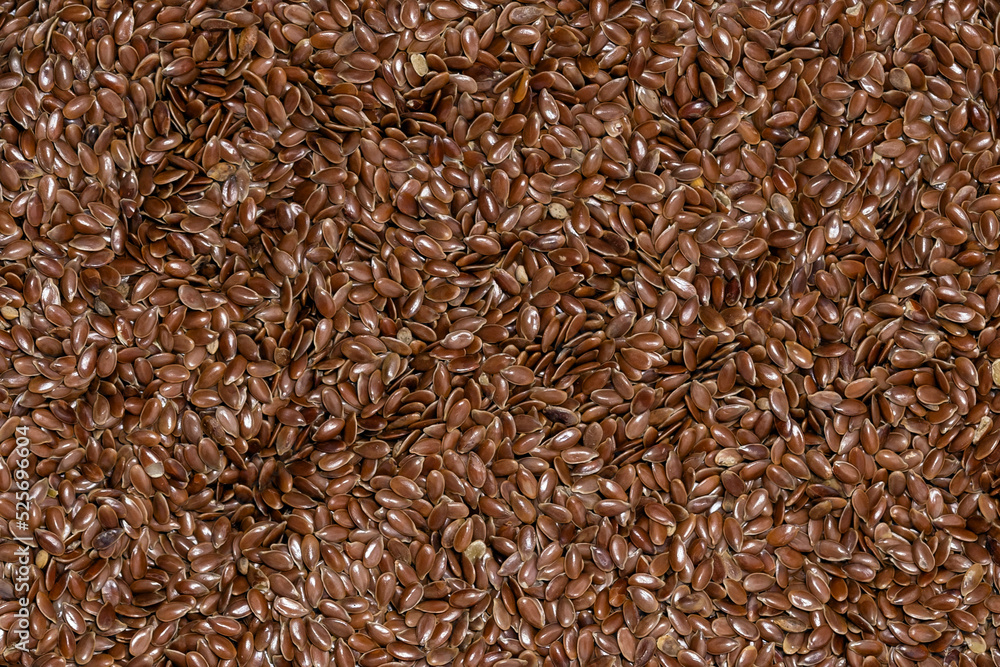 close-up macro photography of flax seeds , brown flaxseed texture background, top view, flat lay