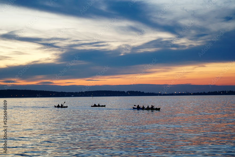 Kayaks on the lake at sunset
