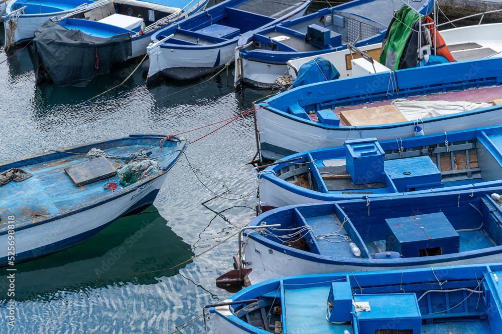 Blue boats abstract composition background. Gallipoli, Puglia, Italy