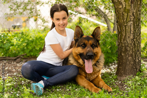 Cheerful little girl with a dog German shepherd © Angelov