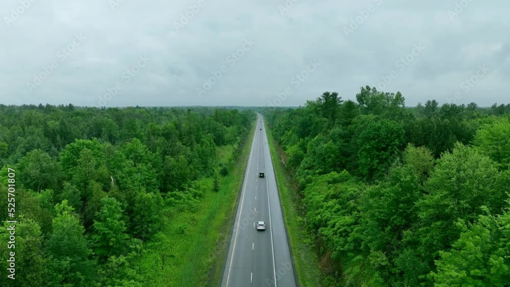 Adventure drone shot of green forest and high way in summer Adventure drone shot of green forest and high way in summer
