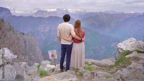 Young couple of a man and woman visit the Grlo Sokolovo, famoust canyon at the Montenegro-Albania border. Travel to Monteegro concept photo