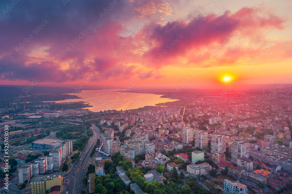 Dramatic sunset over Varna city and Varna lake, Bulgaria. Scenic aerial view landscape.