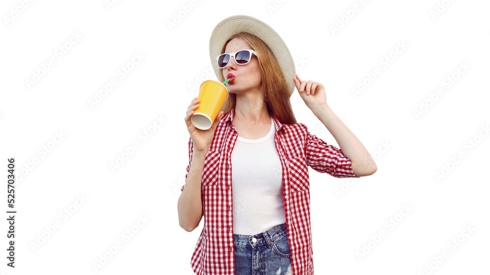 Portrait of young woman drinking fresh juice wearing summer straw hat, checkered shirt isolated on white background Portrait of young woman drinking fresh juice wearing summer straw hat, checkered shirt isolated on white background
