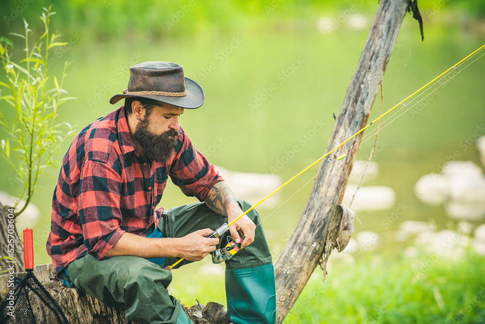 Fishing hobby and summer weekend. Bearded men fisher with fishing rod.