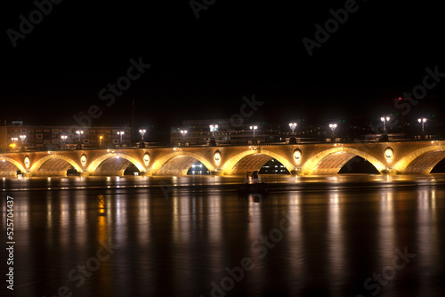 Night view of the famous bridge of Bordeaux called Le Pont de Pierre