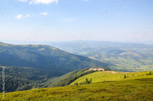 Descent from the Borzhava mountain range with a picturesque view of the valley and the village of Pylypets. Carpathians  Ukraine