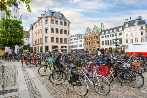 Row after row of bicycles are parked in a group near the Stork Fountain in the Stroget shopping district, the longest pedestrian street in the world, in Copenhagen, Denmark.