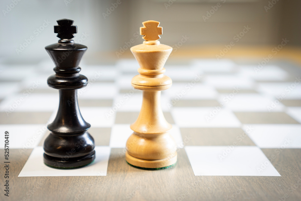 Chess pieces on grey game board two kings Chess pieces on grey game board two kings
