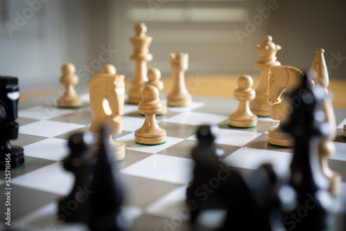 Chess pieces on grey game board