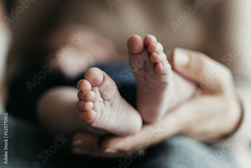 Mom holding baby feet
