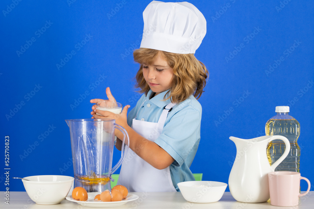 Cooking children. Chef kid boy making fresh vegetables for healthy eat. Portrait of little child in form of cook isolated on grey background. Kid chef. Cooking process. Cooking children. Chef kid boy making fresh vegetables for healthy eat. Portrait of little child in form of cook isolated on grey background. Kid chef. Cooking process.
