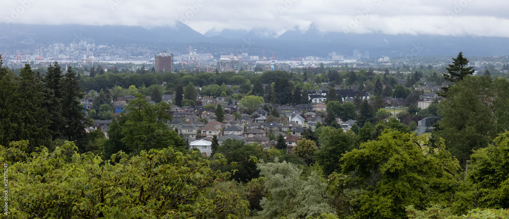 Residential Homes, Modern City and Mountain Landscape. View from Queen Elizabeth Park, Vancouver, British Columbia, Canada.