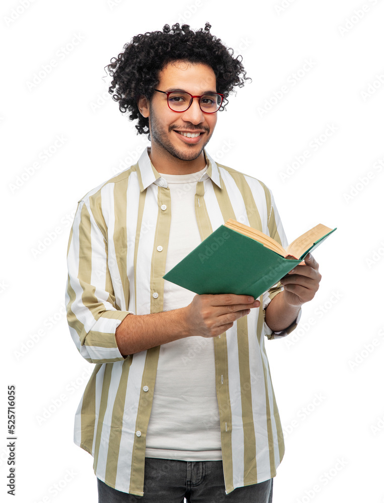 knowledge, education and people concept - happy smiling young man in glasses reading book over white background knowledge, education and people concept - happy smiling young man in glasses reading book over white background